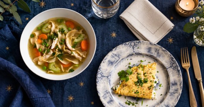 Zodiac dinner real table Soup and an herb omelette on an indigo star-patterned dinner table.
